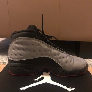 Jordan 13 Retro reflective silver/red/black PRM.